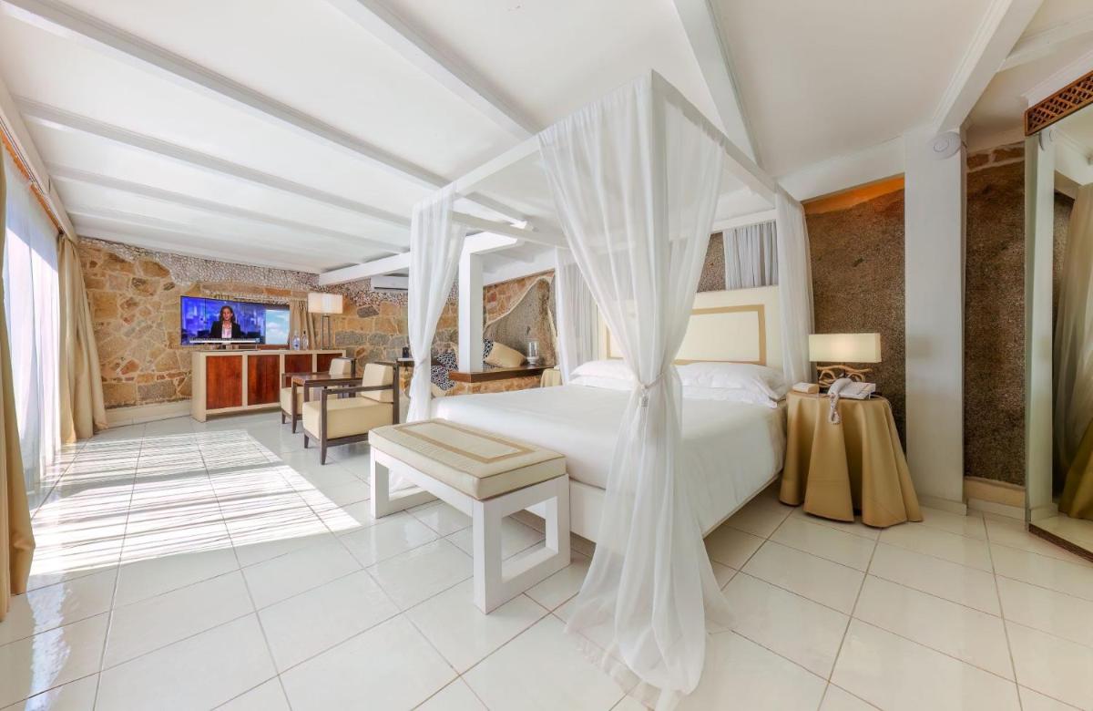 Un ou plusieurs lits dans un hébergement de l'établissement Hotel & SPA des Pecheurs