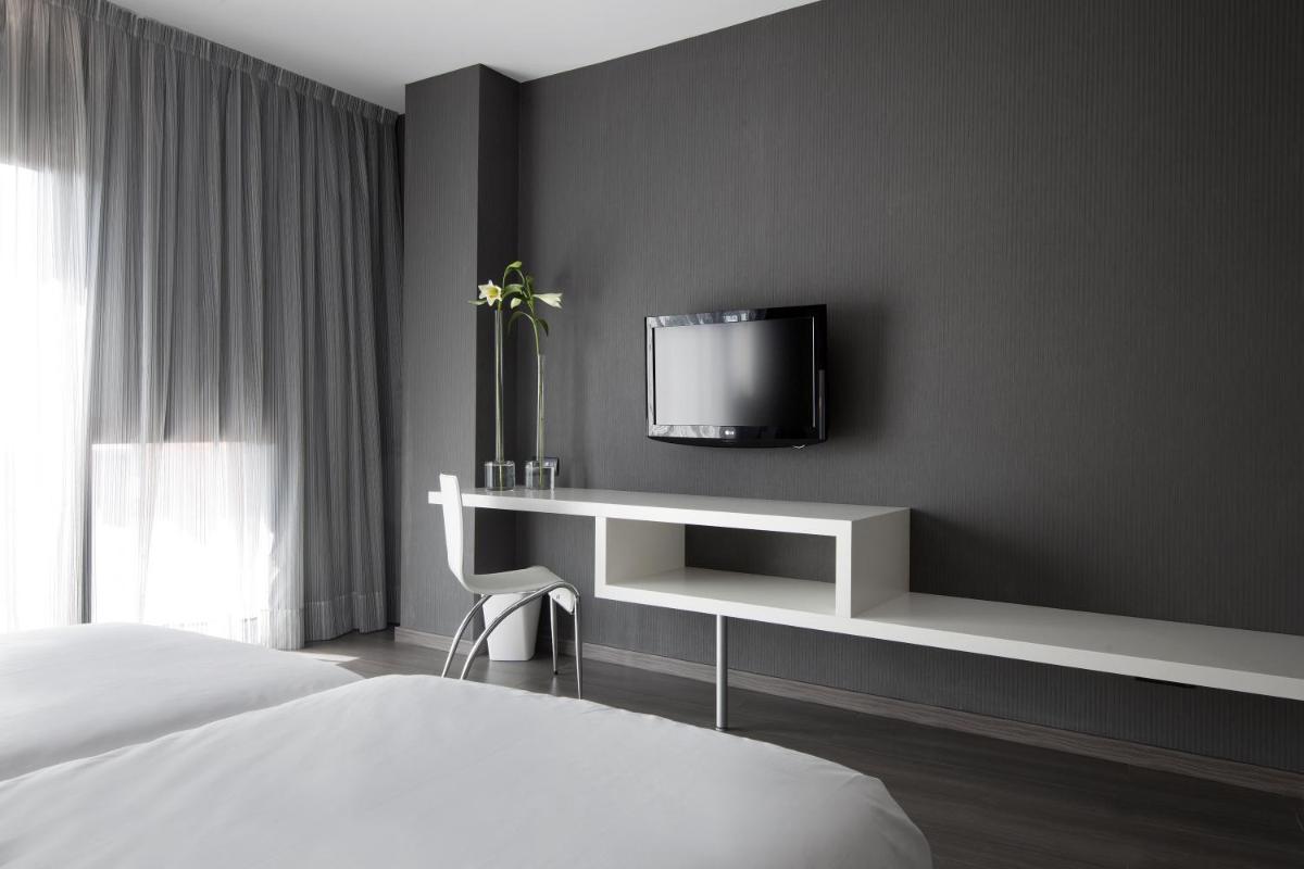 Cama o camas de una habitación en Hotel MasMonzon