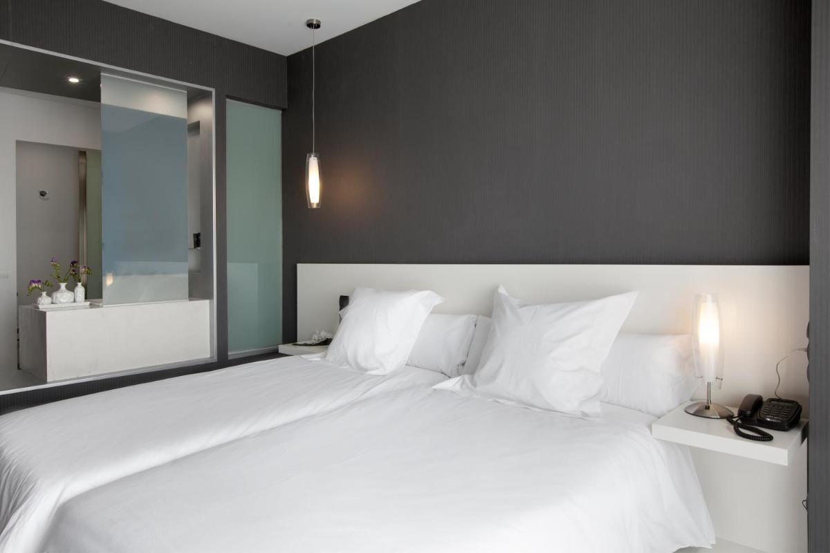 Cama o camas de una habitación en Hotel MasMonzon