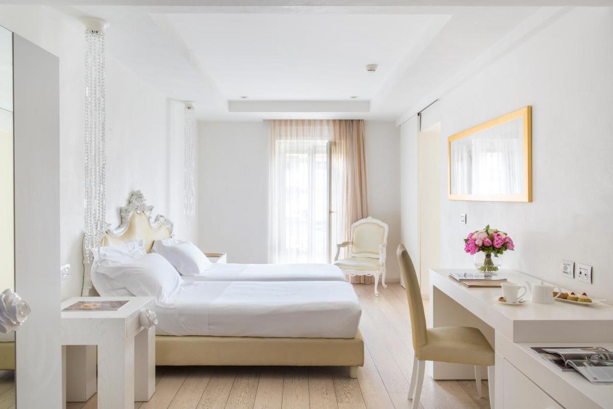 Un ou plusieurs lits dans un hébergement de l'établissement Boscolo Nice Hotel & Spa