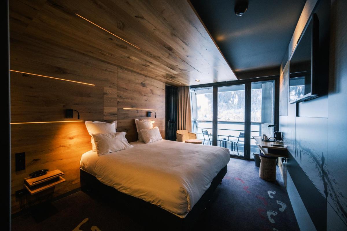 Un ou plusieurs lits dans un hébergement de l'établissement Alpina Eclectic Hotel