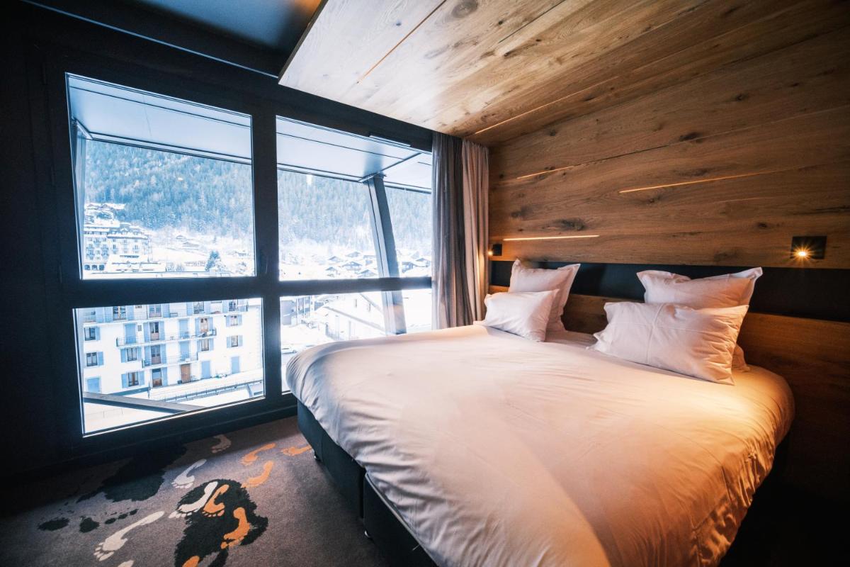 Un ou plusieurs lits dans un hébergement de l'établissement Alpina Eclectic Hotel