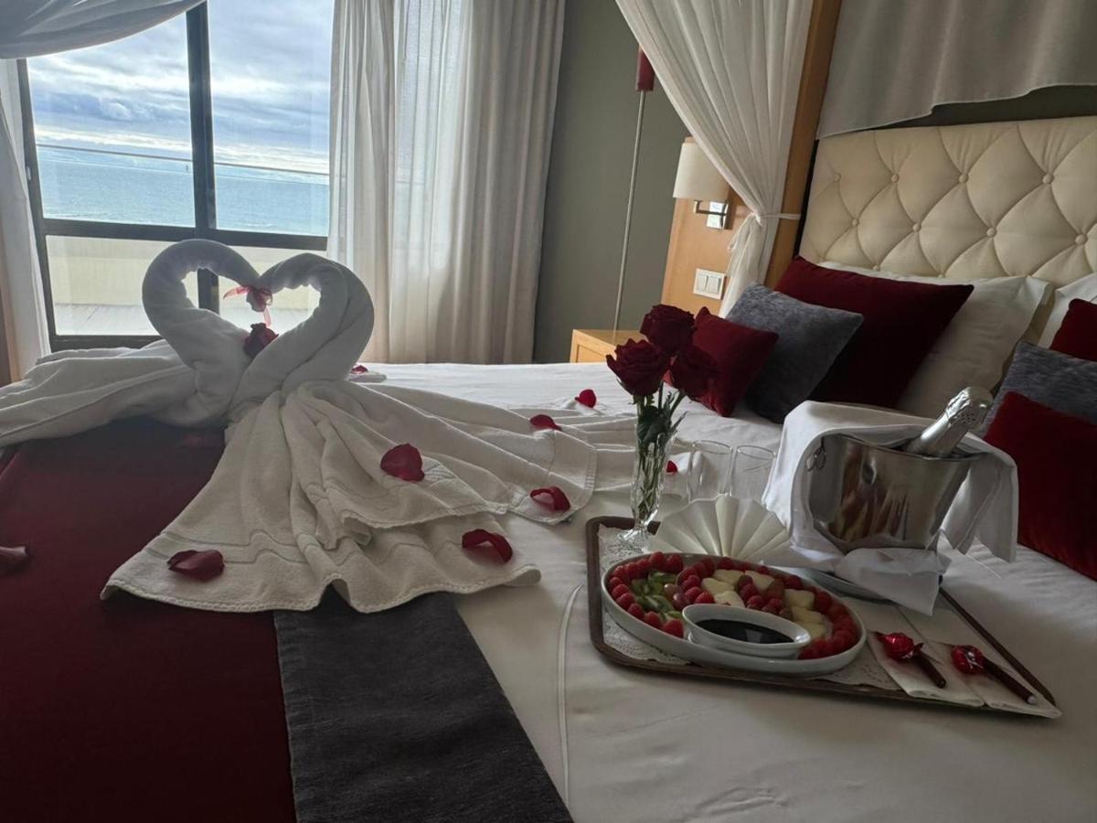 Uma cama ou camas num quarto em Hotel Atlantida Sol