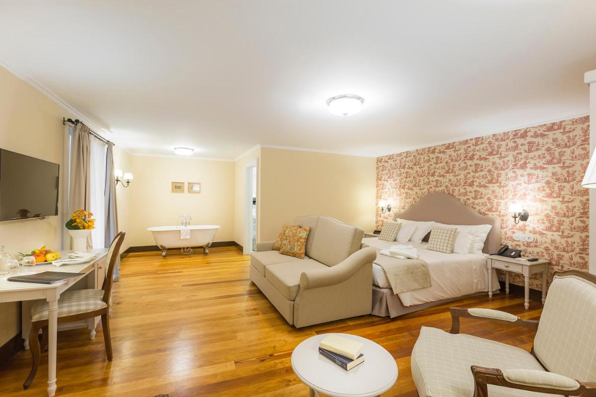 Uma área de estar em Castanheiro Boutique Hotel