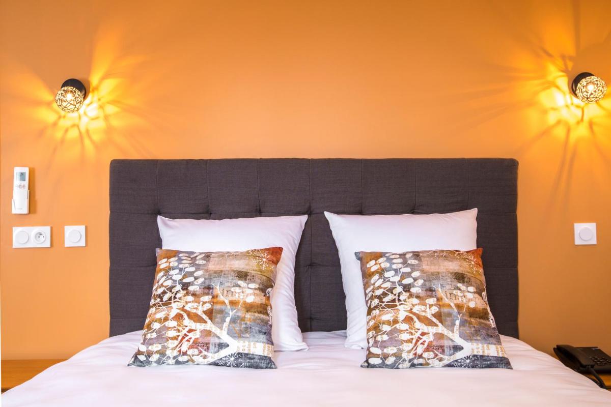 Un ou plusieurs lits dans un hébergement de l'établissement Hotel Clos Castel Villas Spa