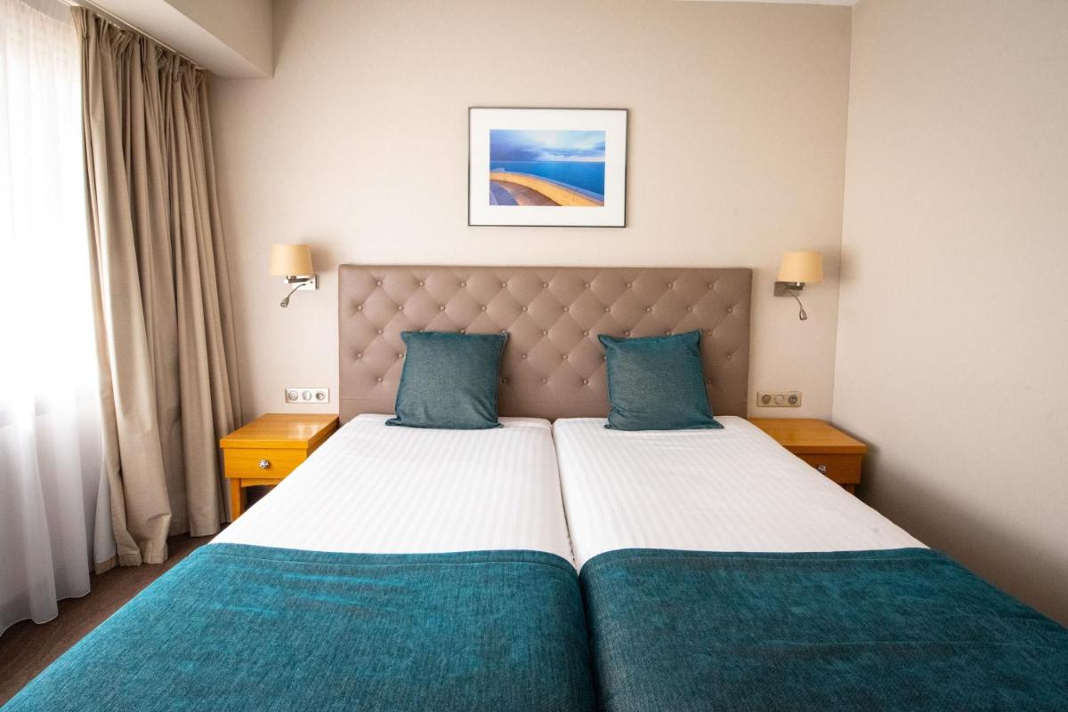 Un ou plusieurs lits dans un hébergement de l'établissement Splendid Hotel & Spa Nice