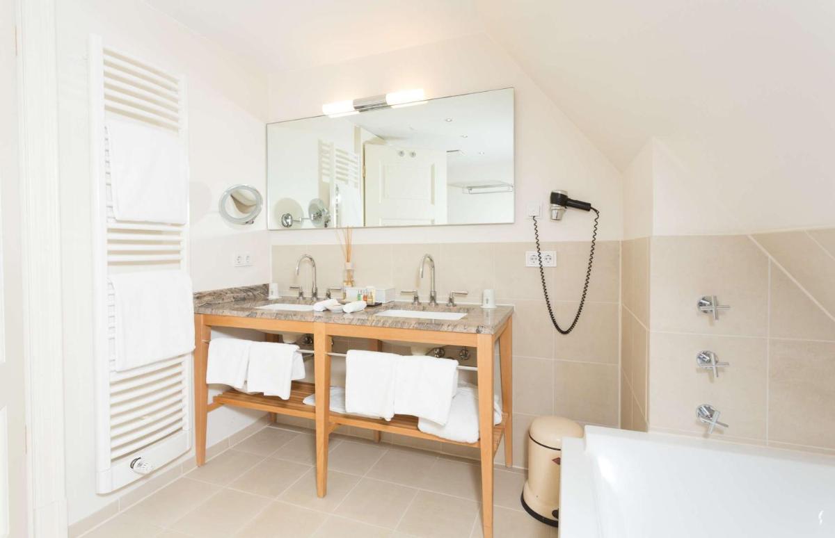 Ein Badezimmer in der Unterkunft Schlosshotel Münchhausen