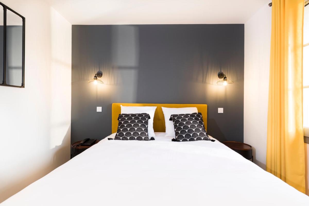 Un ou plusieurs lits dans un hébergement de l'établissement Hotel Clos Castel Villas Spa