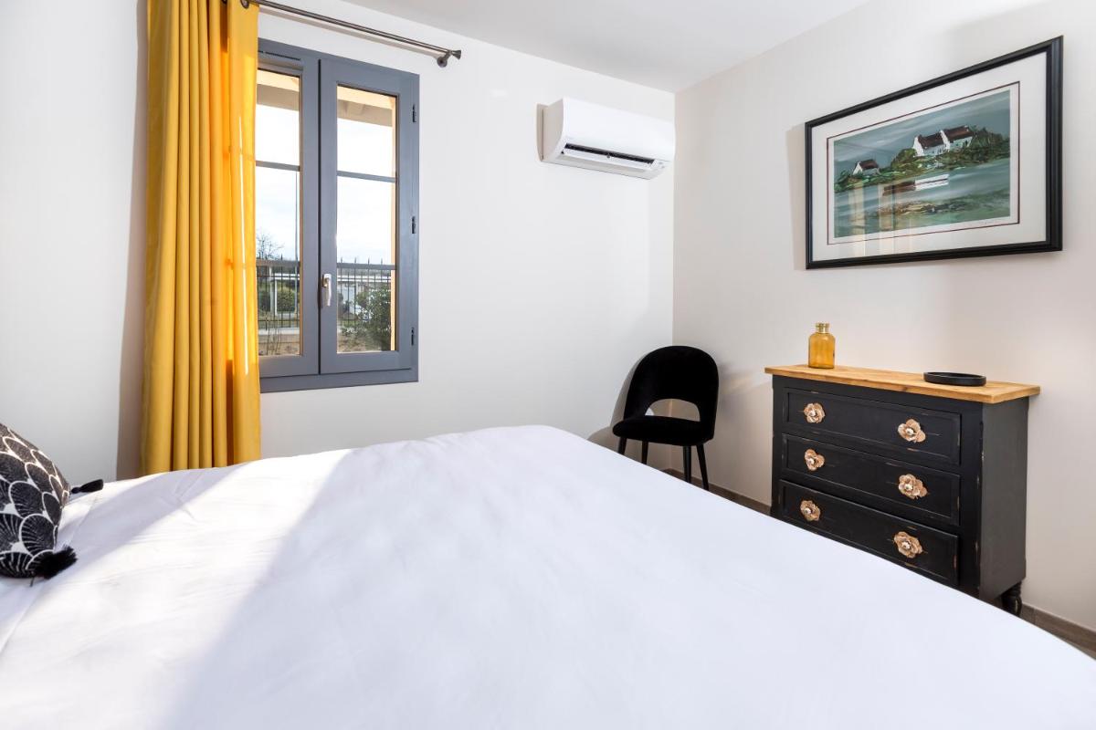 Un ou plusieurs lits dans un hébergement de l'établissement Hotel Clos Castel Villas Spa
