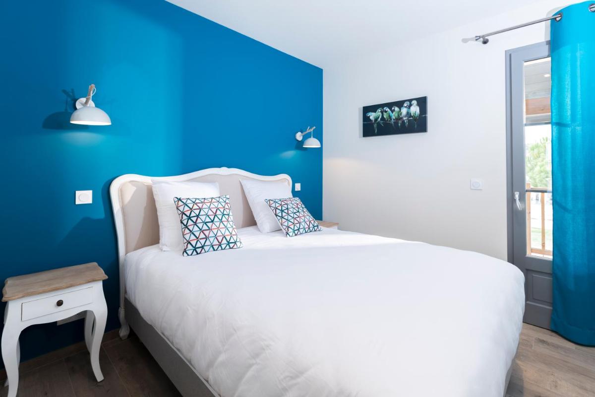 Un ou plusieurs lits dans un hébergement de l'établissement Hotel Clos Castel Villas Spa
