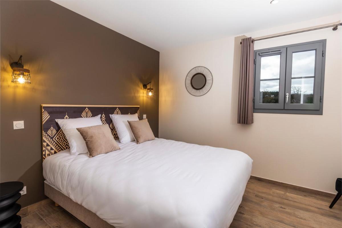 Un ou plusieurs lits dans un hébergement de l'établissement Hotel Clos Castel Villas Spa