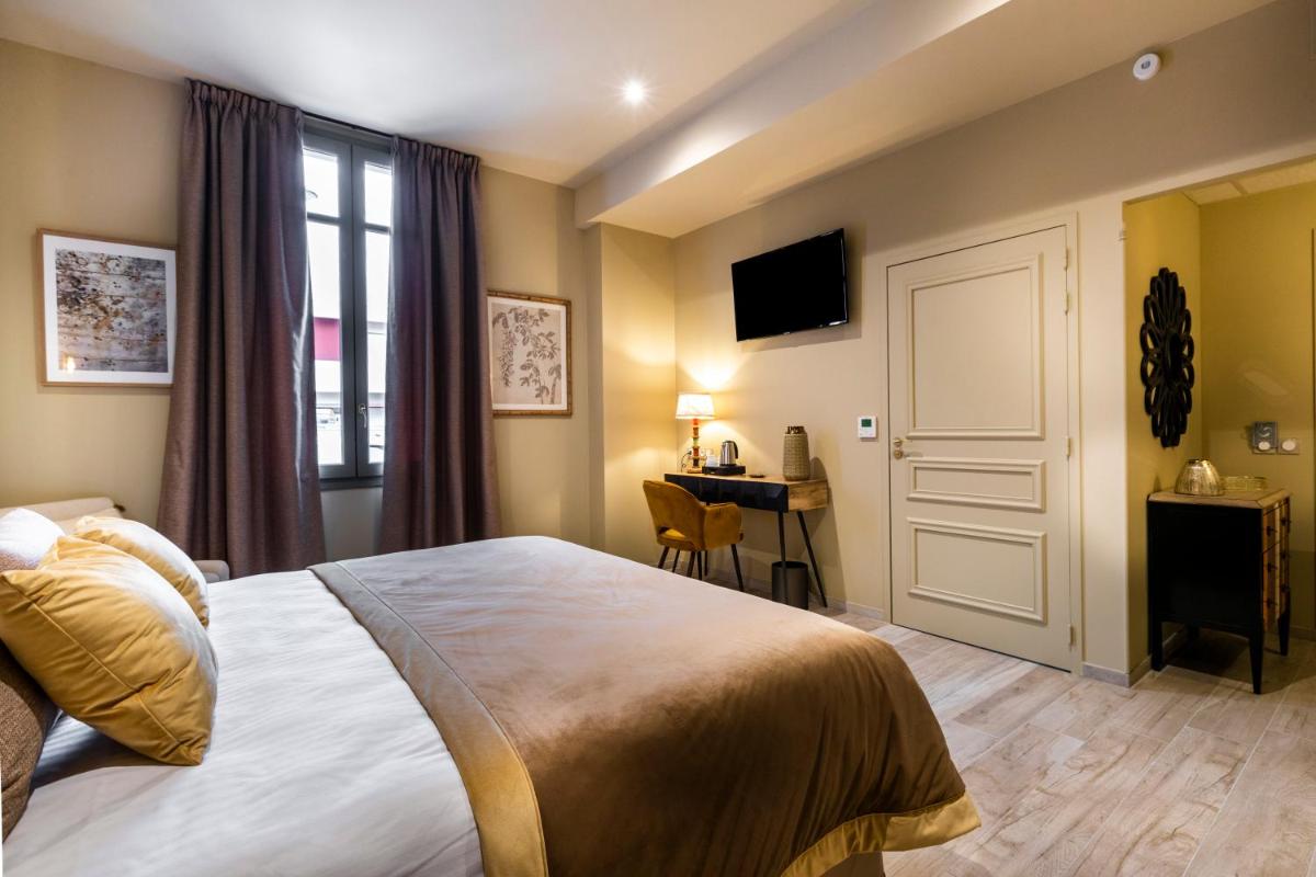 Un ou plusieurs lits dans un hébergement de l'établissement Hotel Clos Castel Villas Spa