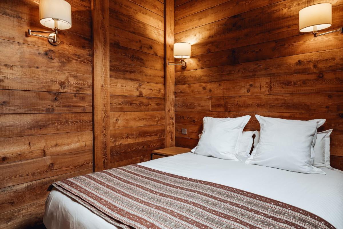 Un ou plusieurs lits dans un hébergement de l'établissement Alliey & Spa Piscine Appart-hôtel Serre chevalier