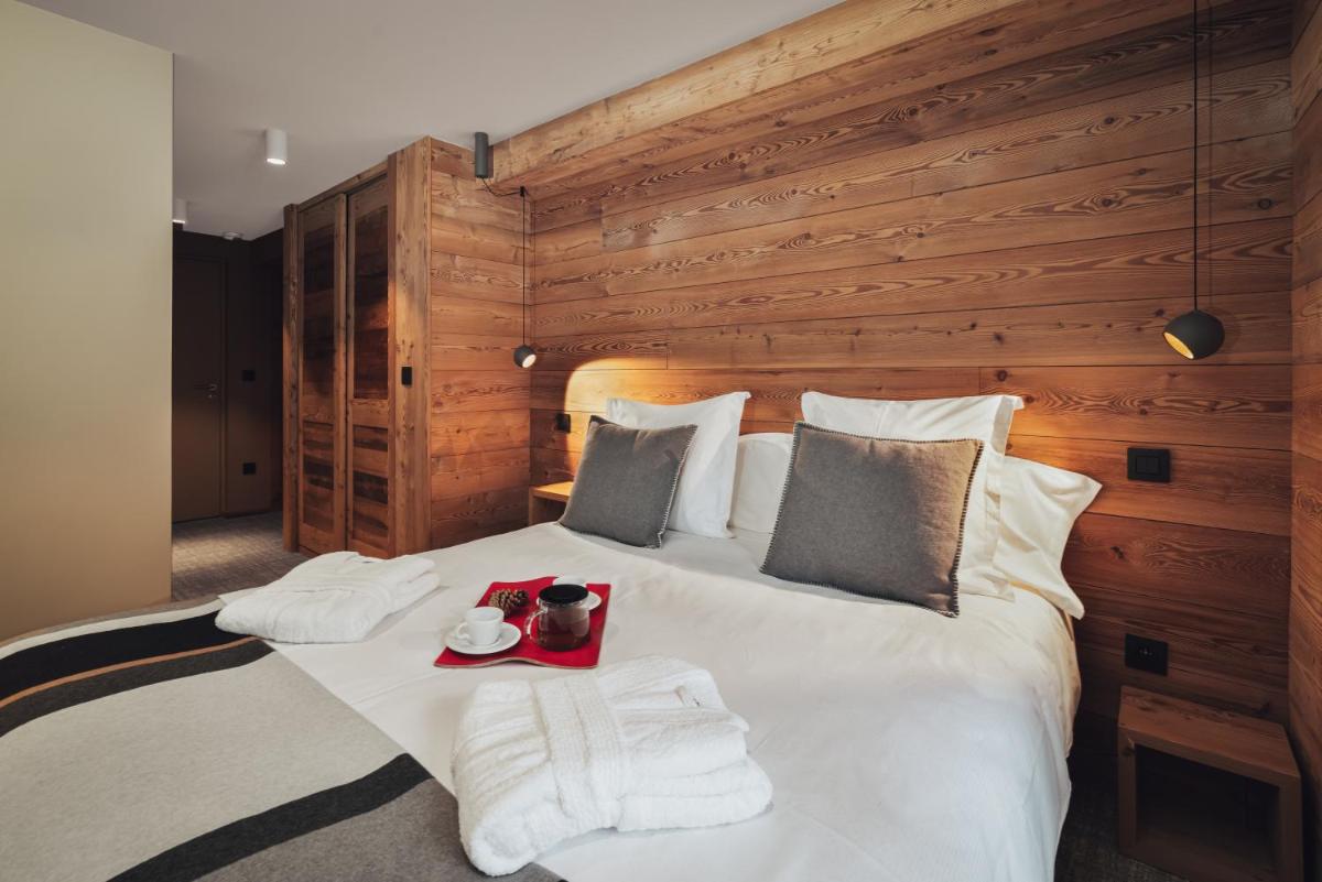 Un ou plusieurs lits dans un hébergement de l'établissement Alliey & Spa Piscine Appart-hôtel Serre chevalier