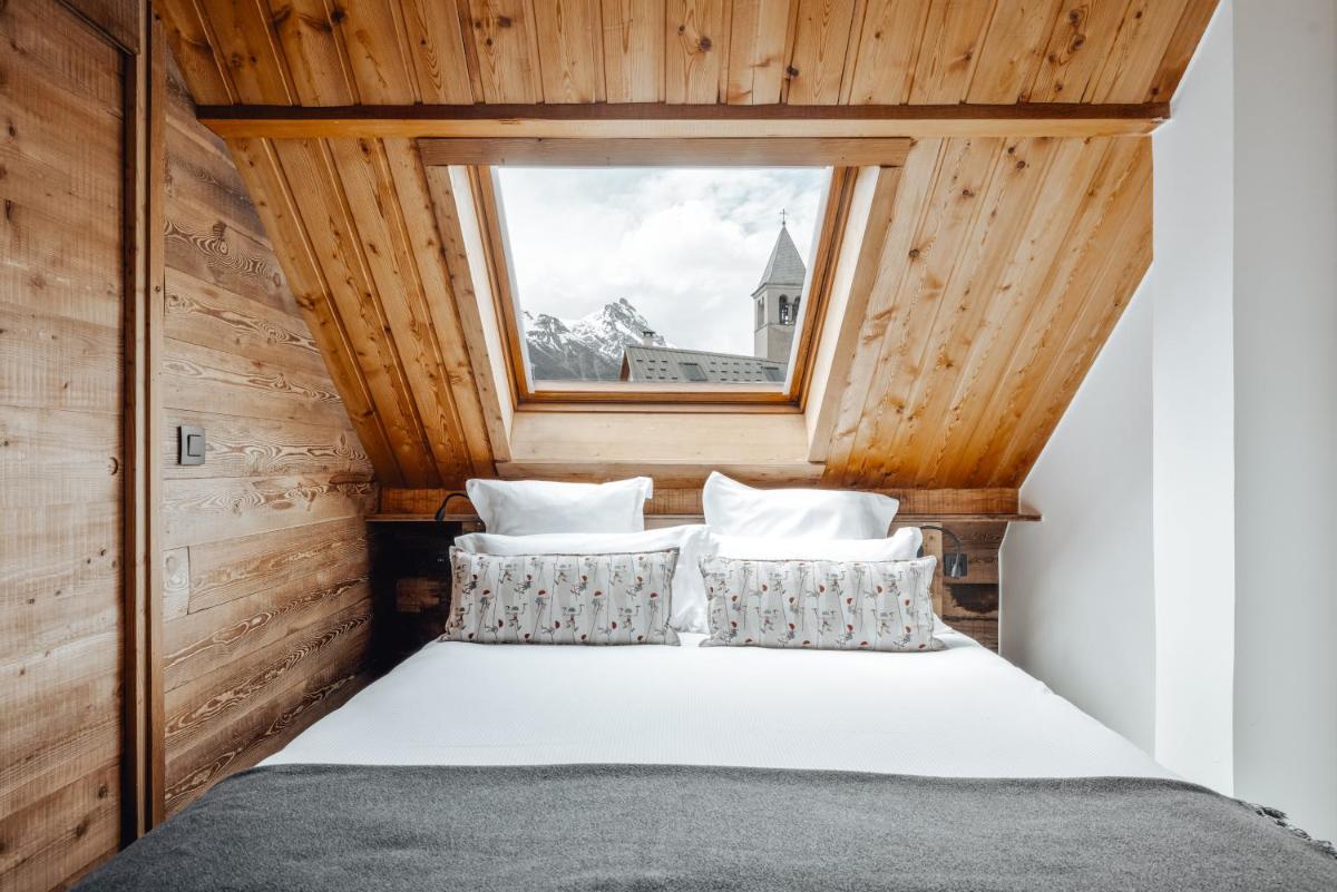 Un ou plusieurs lits dans un hébergement de l'établissement Alliey & Spa Piscine Appart-hôtel Serre chevalier