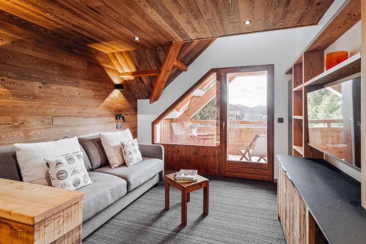 Coin salon dans l'établissement Alliey & Spa Piscine Appart-hôtel Serre chevalier