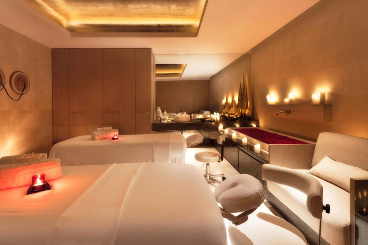 a hotel room with two beds and a kitchen at The Westin Gurgaon, New Delhi in Gurgaon