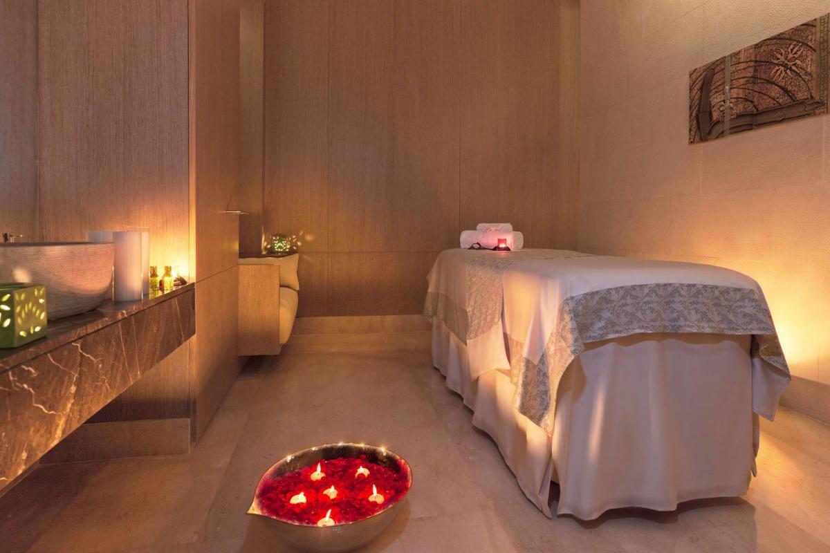 a bathroom with a bed and a bowl of red lights at The Westin Gurgaon, New Delhi in Gurgaon