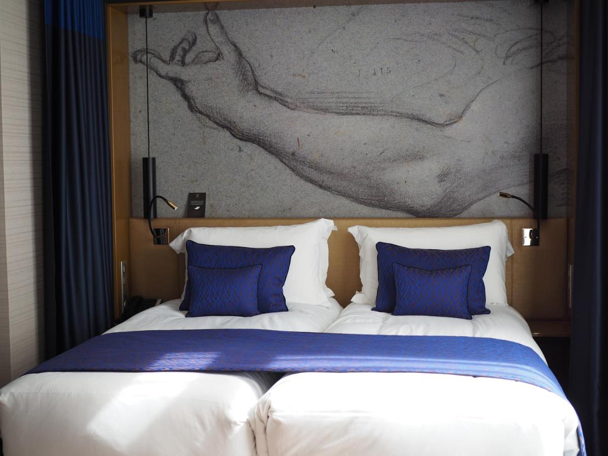 Un ou plusieurs lits dans un hébergement de l'établissement Grand Hôtel La Cloche Dijon - MGallery Collection