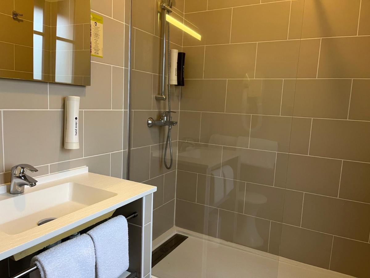 Salle de bains dans l'établissement Hotel Normandy