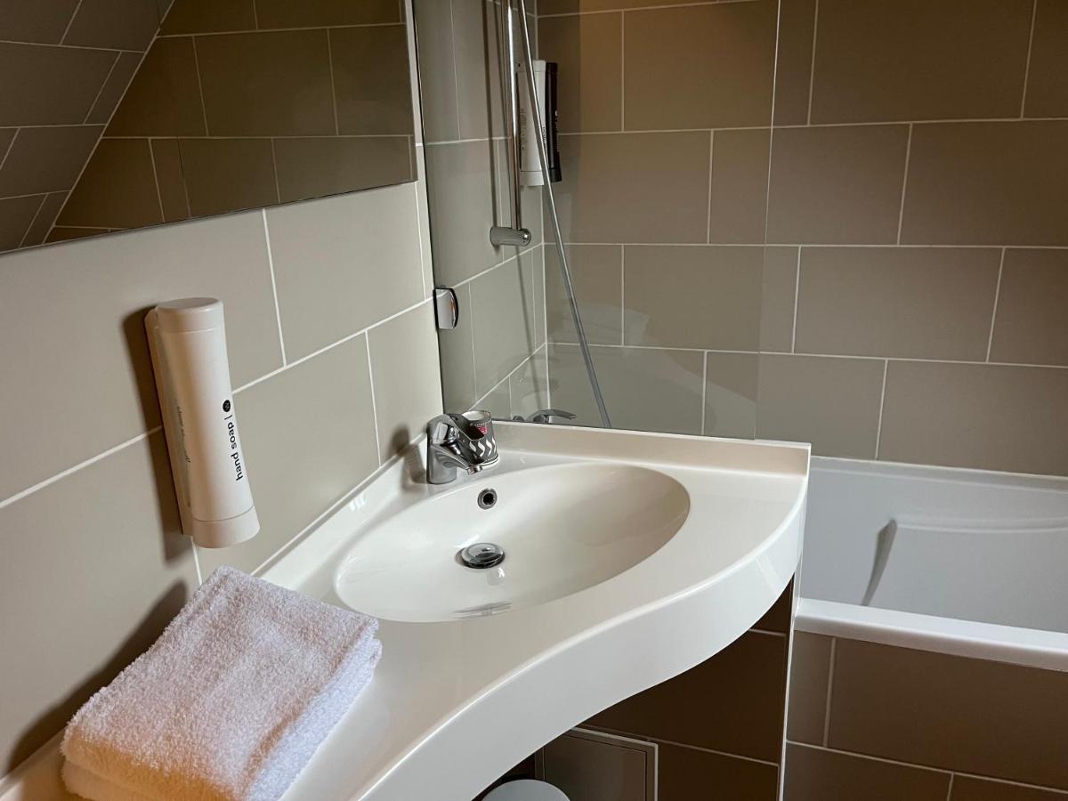 Salle de bains dans l'établissement Hotel Normandy