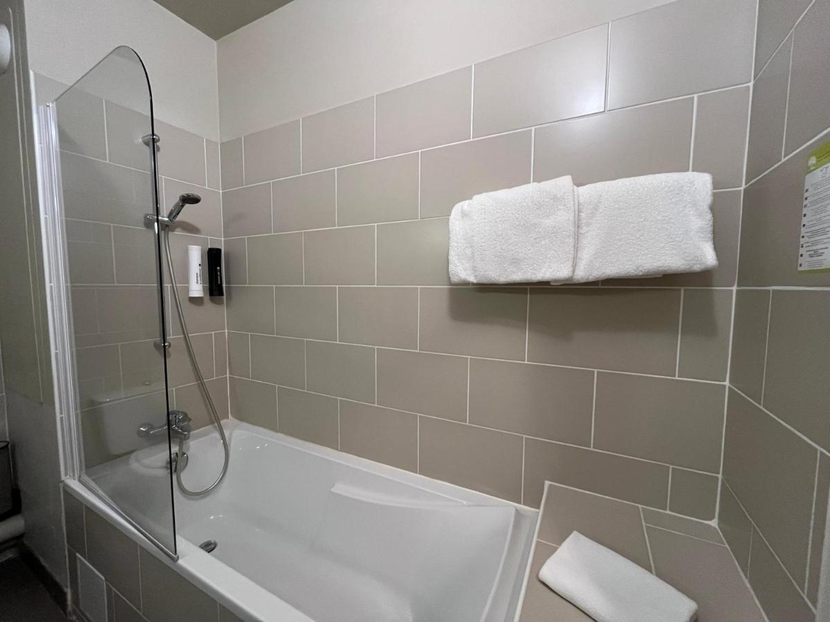 Salle de bains dans l'établissement Hotel Normandy