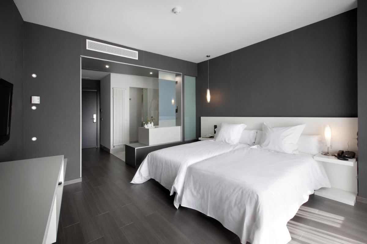 Cama o camas de una habitación en Hotel MasMonzon
