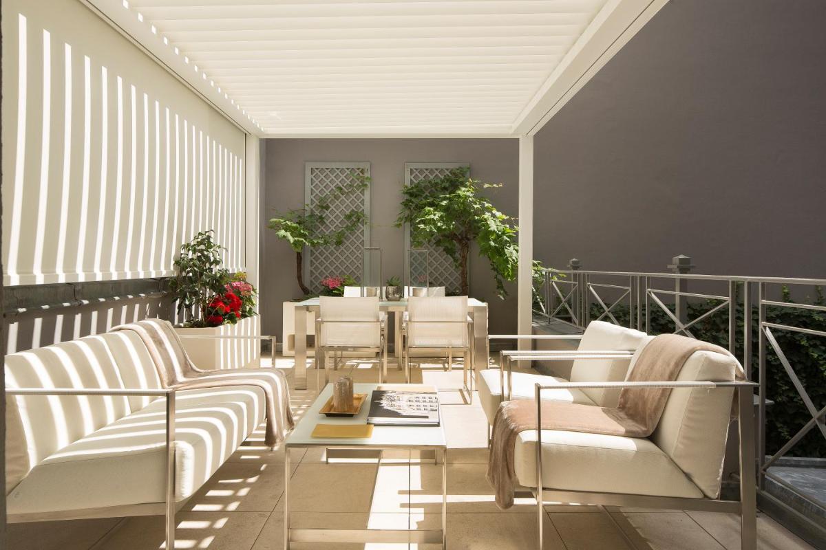 Coin salon dans l'établissement Hôtel Baume