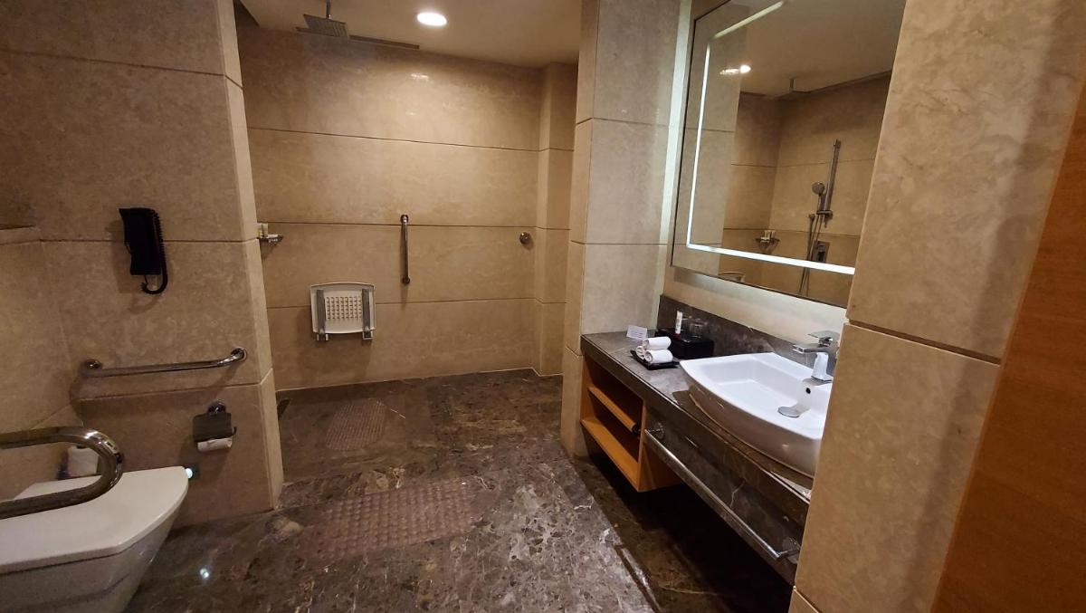a bathroom with a sink and a mirror at InterContinental Jaipur Tonk Road by IHG in Jaipur