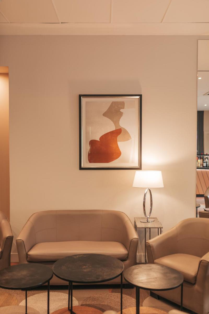 Coin salon dans l'établissement Le Dracy Hôtel et Spa