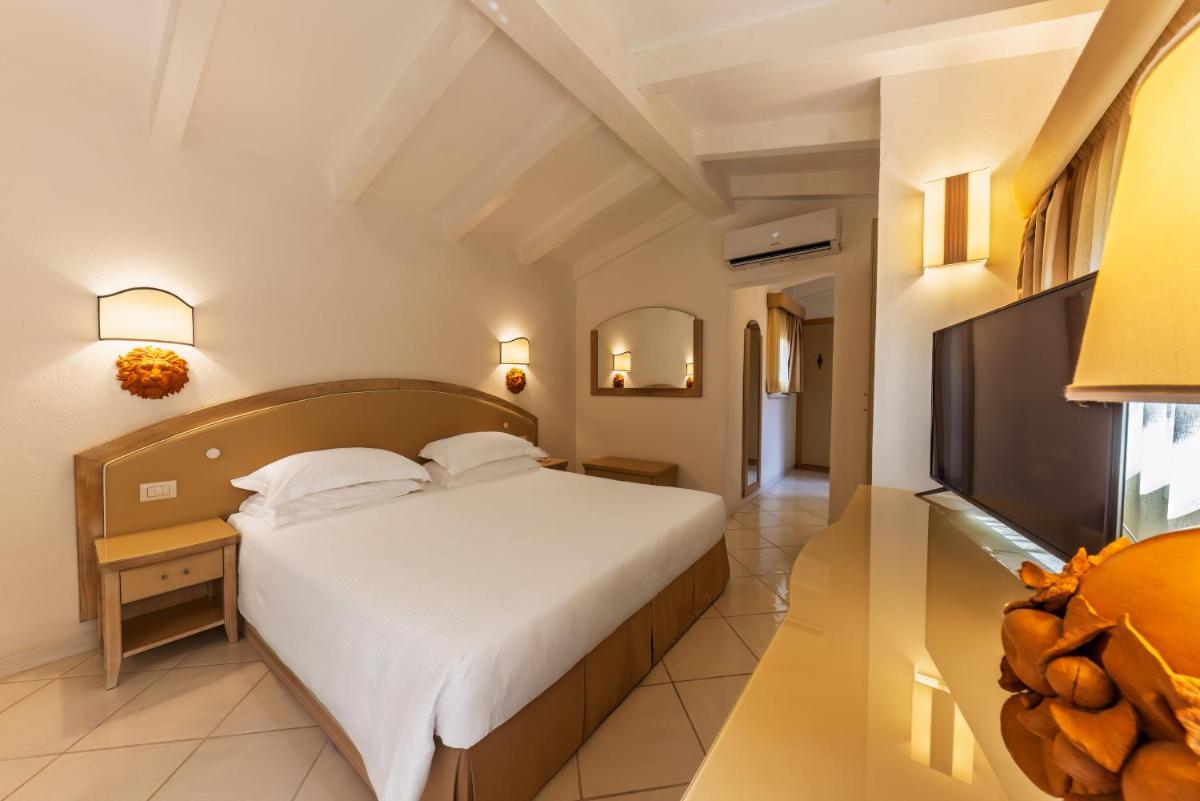 Un ou plusieurs lits dans un hébergement de l'établissement Hotel & SPA des Pecheurs