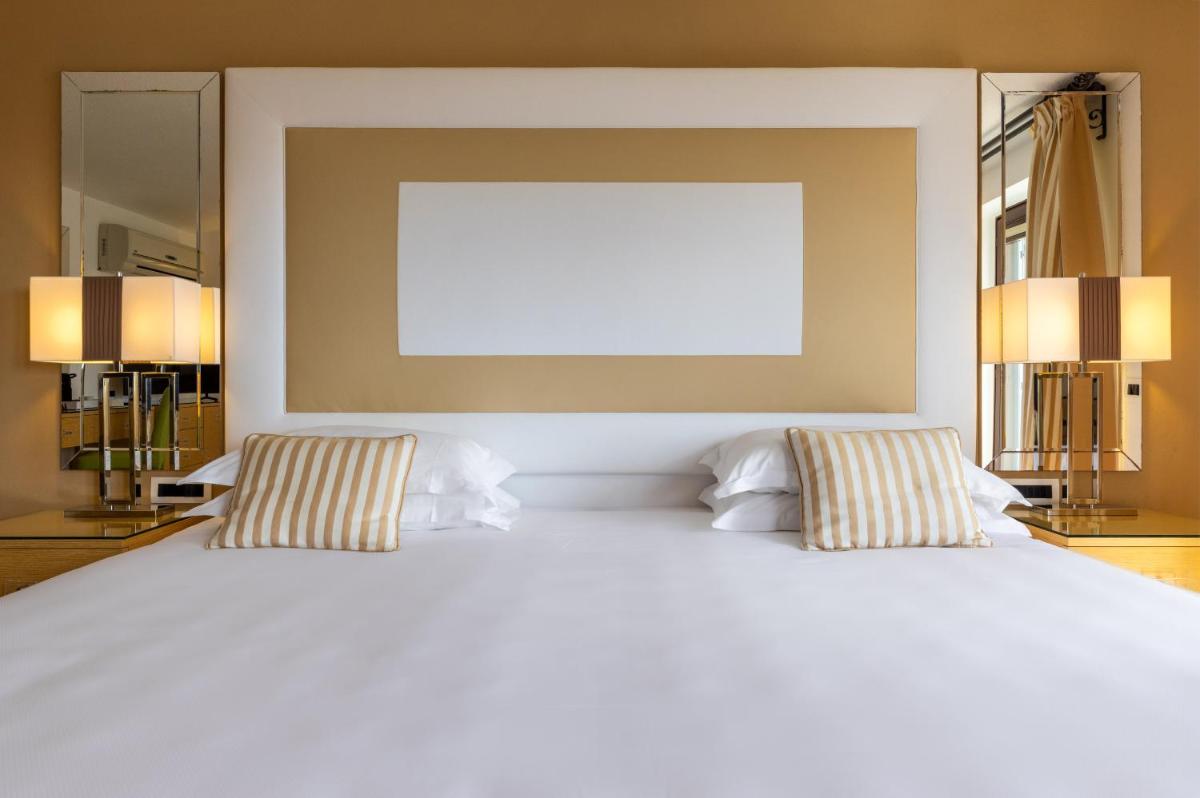 Un ou plusieurs lits dans un hébergement de l'établissement Hotel & SPA des Pecheurs