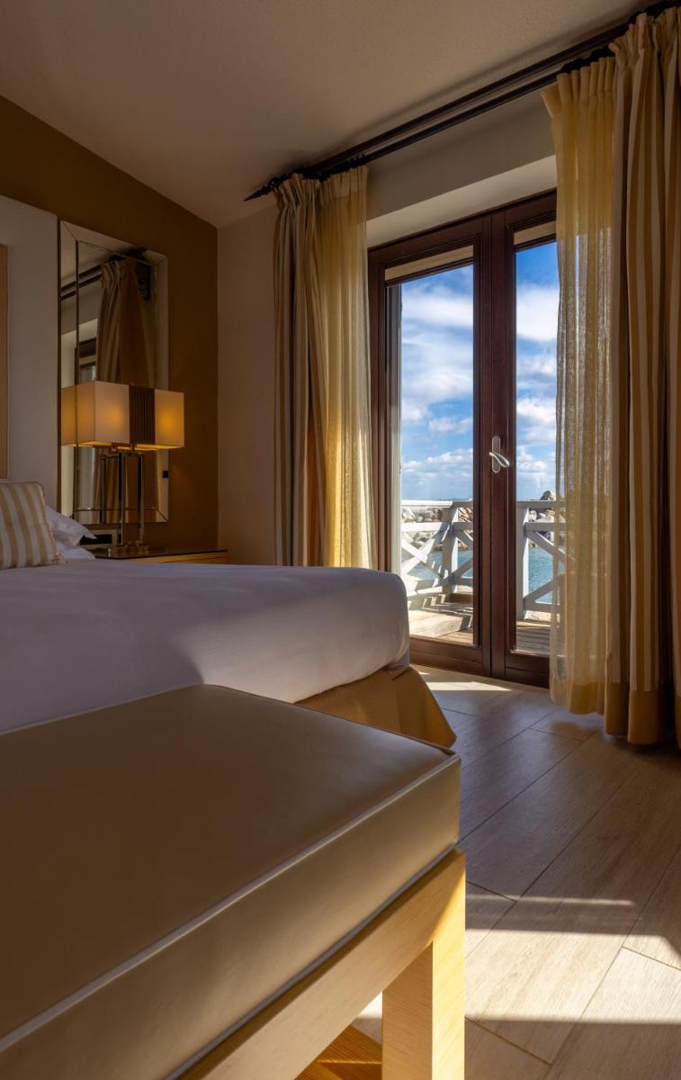 Un ou plusieurs lits dans un hébergement de l'établissement Hotel & SPA des Pecheurs