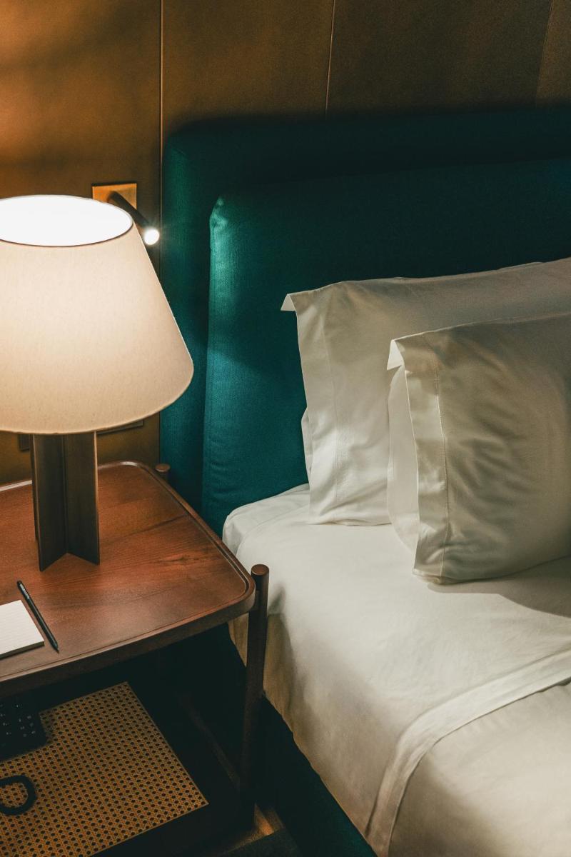 Uma cama ou camas num quarto em Palacete Severo