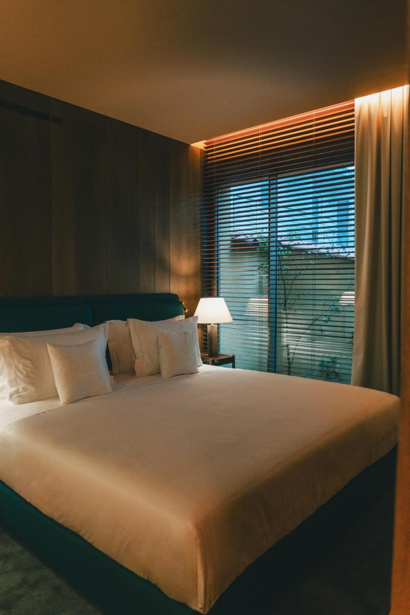 Uma cama ou camas num quarto em Palacete Severo