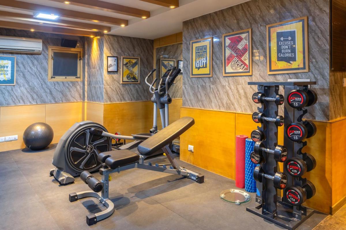 a gym with exercise equipment in a room at Park Inn by Radisson,South Delhi in New Delhi a gym with exercise equipment in a room at Park Inn by Radisson,South Delhi in New Delhi