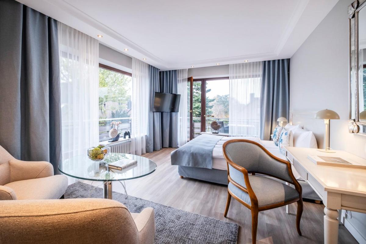Büngers Apartment-Hotel mit Gartensauna - modern, gemütlich und strandnah - Housity