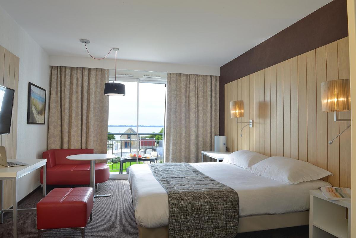 Un ou plusieurs lits dans un hébergement de l'établissement Thalasso Concarneau Spa Marin Resort