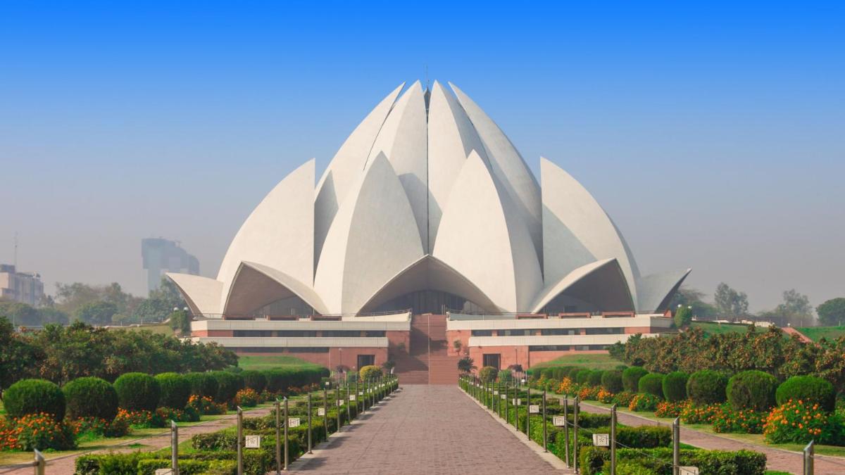 a large white building with a pathway in front at Crowne Plaza New Delhi Okhla by IHG in New Delhi