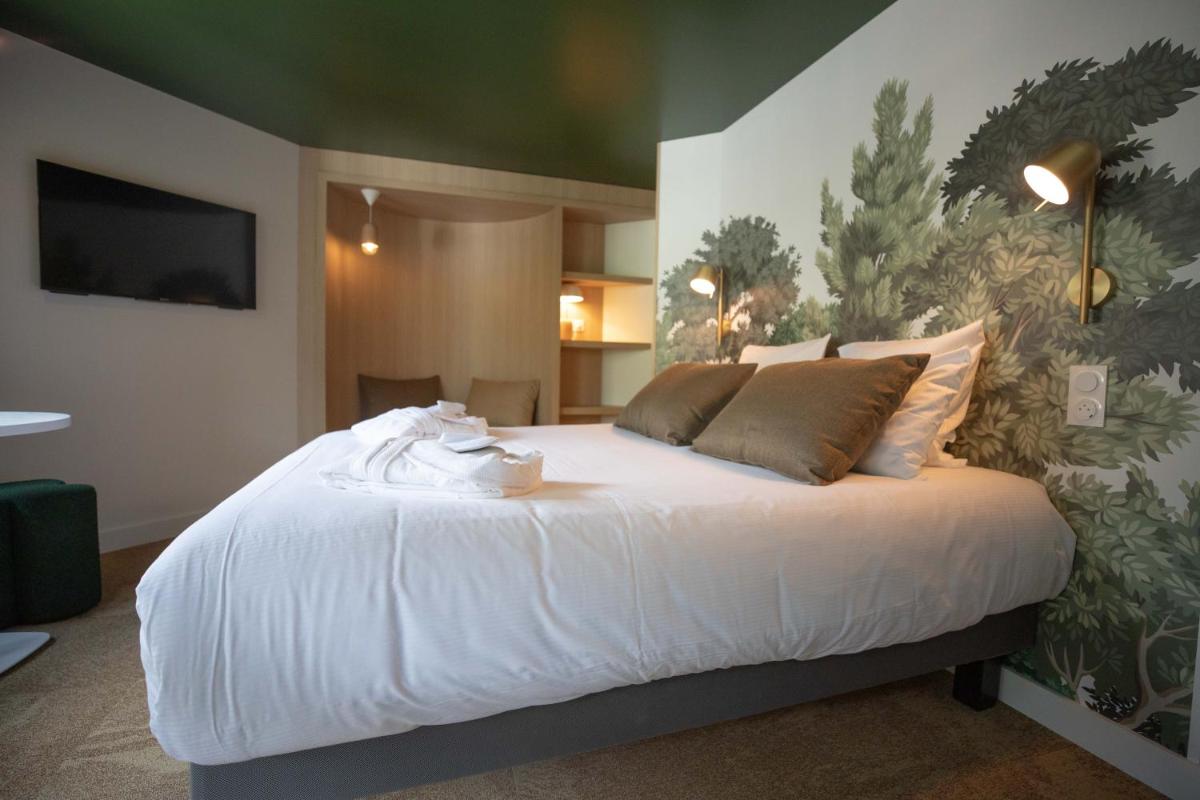 Un ou plusieurs lits dans un hébergement de l'établissement Lykke Hôtel & Spa Chamonix - ex Mercure
