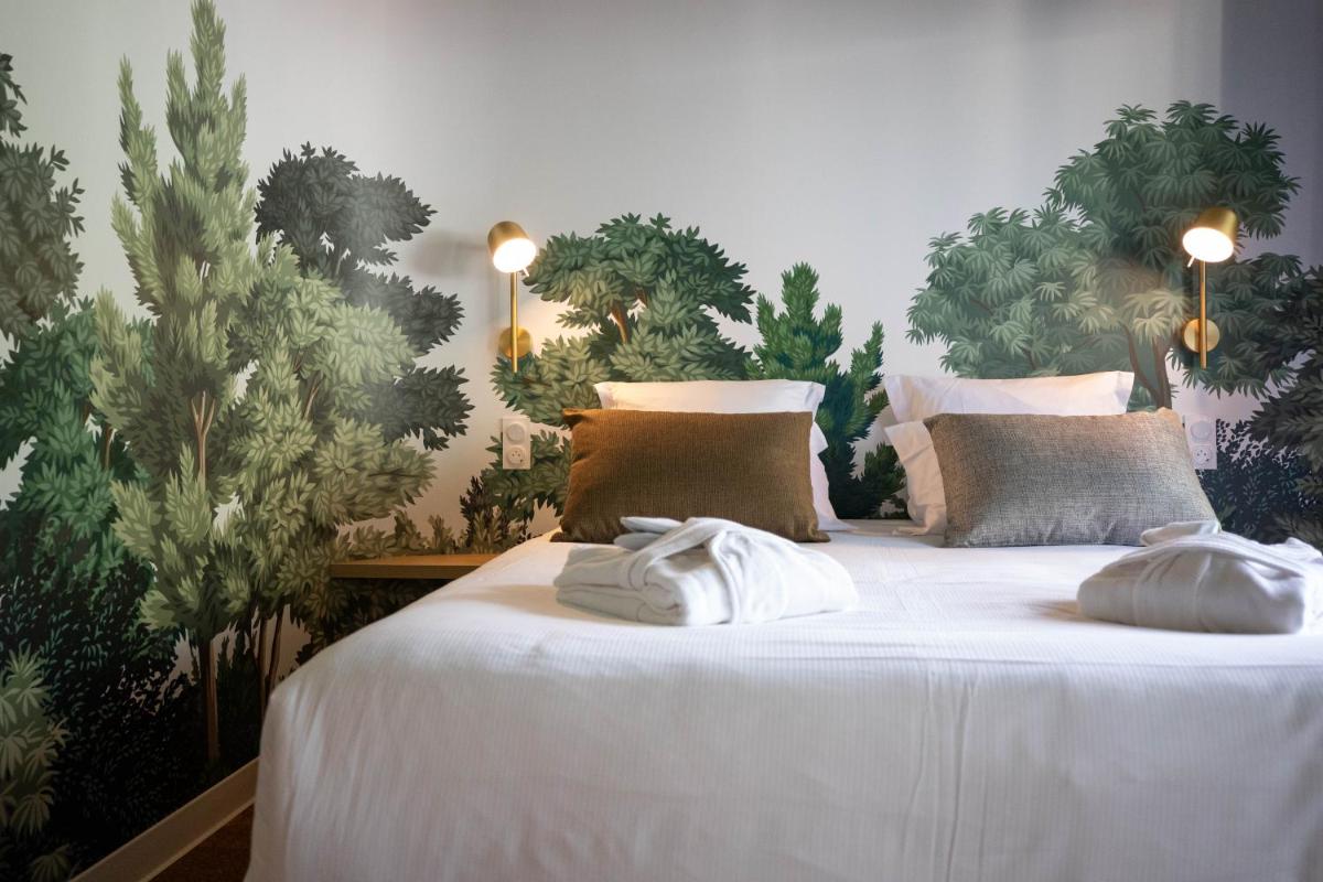 Un ou plusieurs lits dans un hébergement de l'établissement Lykke Hôtel & Spa Chamonix - ex Mercure