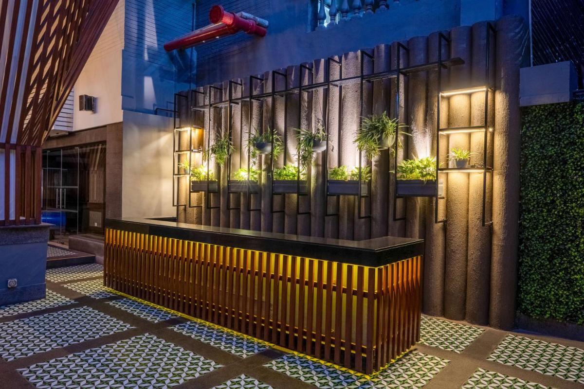 a church altar with plants on a wall at Park Inn by Radisson,South Delhi in New Delhi a church altar with plants on a wall at Park Inn by Radisson,South Delhi in New Delhi