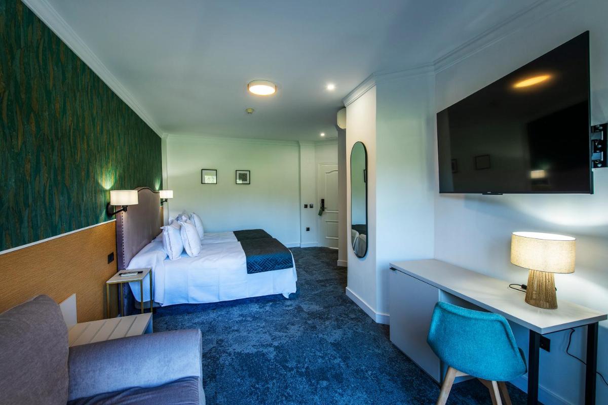 Cama o camas de una habitación en Hotel Tamisa Golf