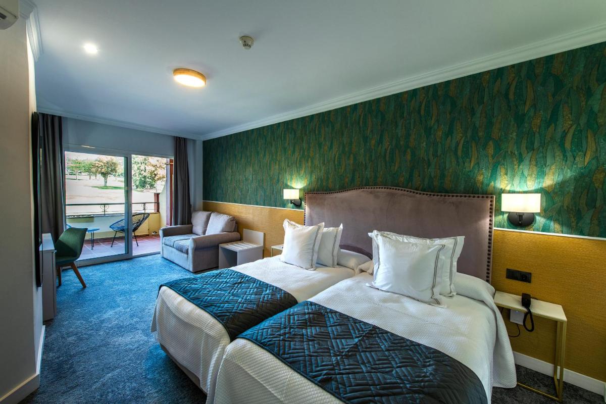 Cama o camas de una habitación en Hotel Tamisa Golf