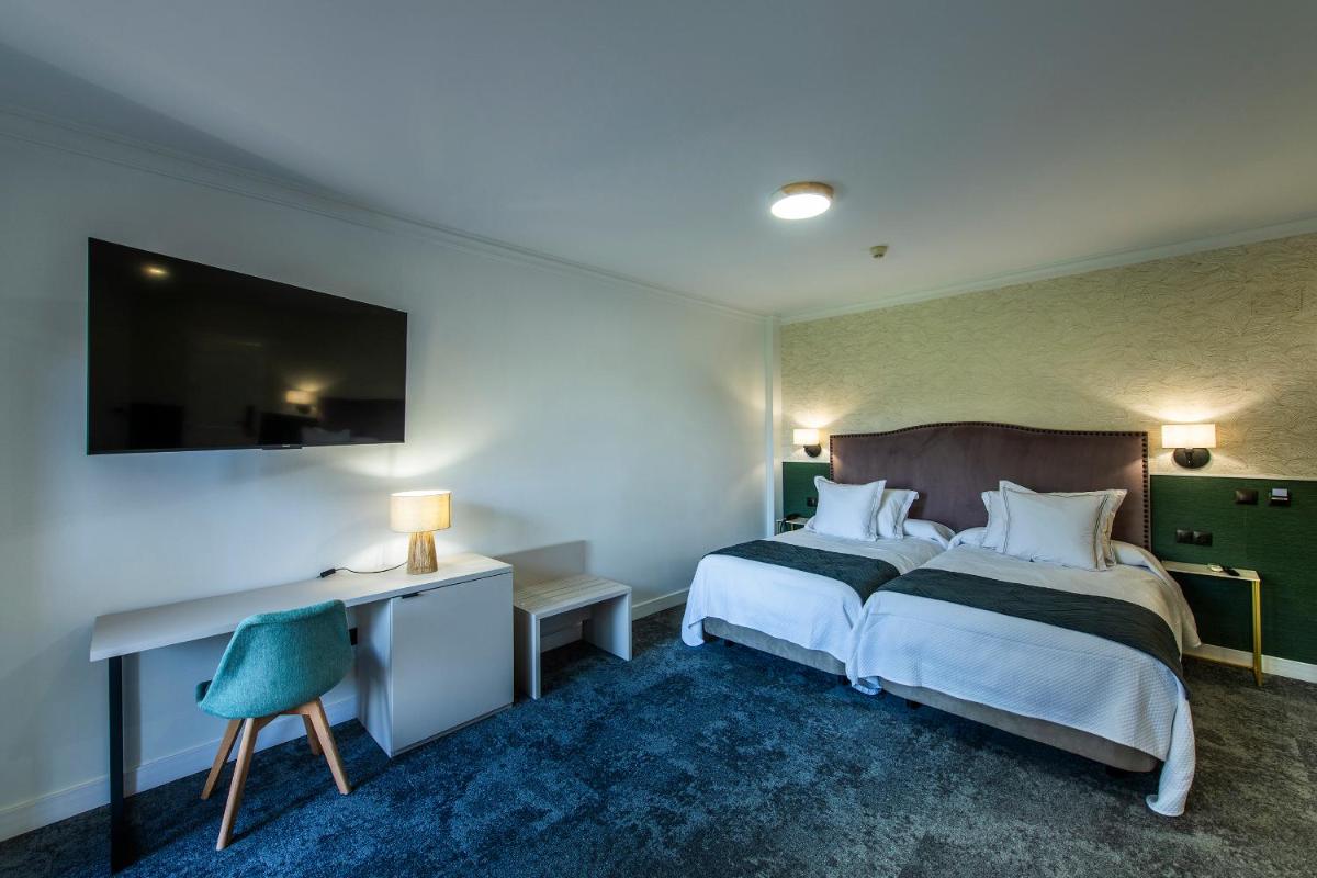 Cama o camas de una habitación en Hotel Tamisa Golf