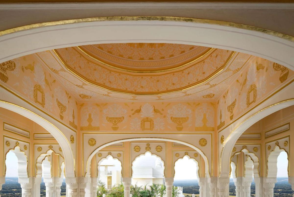 an ornate ceiling of a building with columns and avisor at Hyatt Regency Jaipur Mansarovar in Jaipur an ornate ceiling of a building with columns and avisor at Hyatt Regency Jaipur Mansarovar in Jaipur