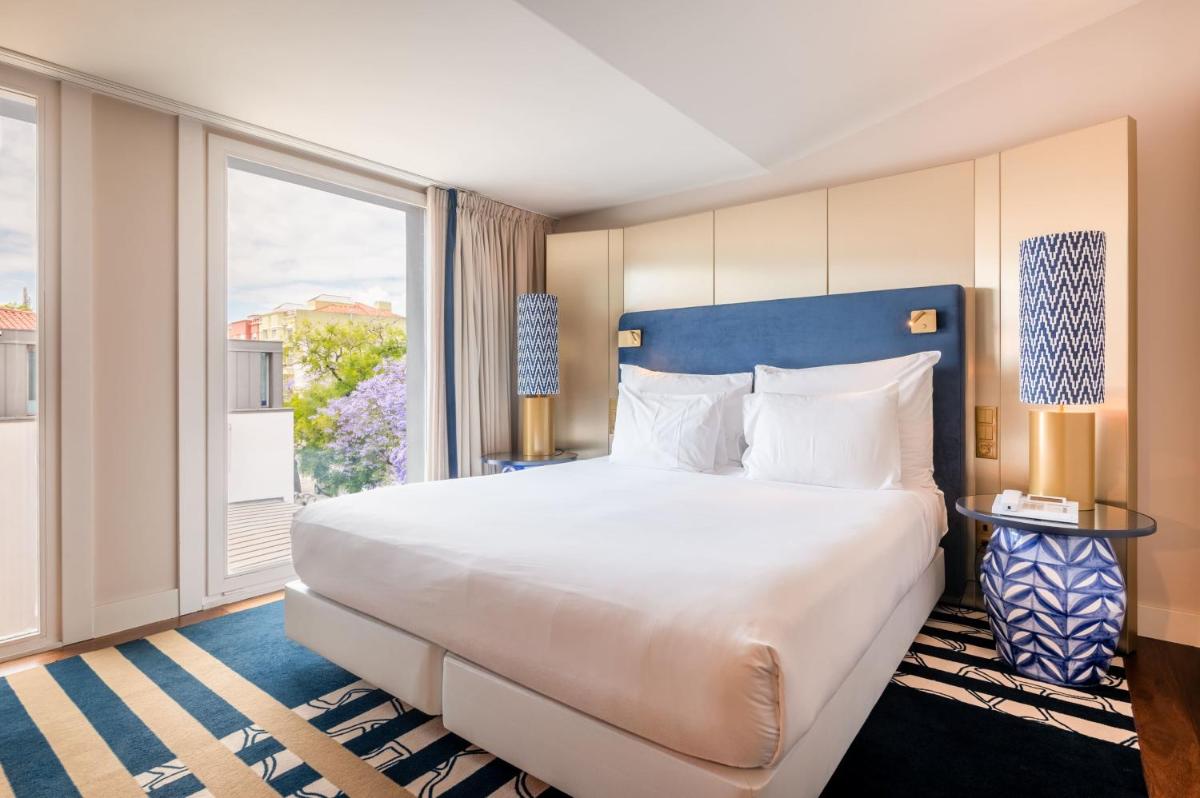Uma cama ou camas num quarto em Palácio do Governador - Lisbon Hotel & Spa