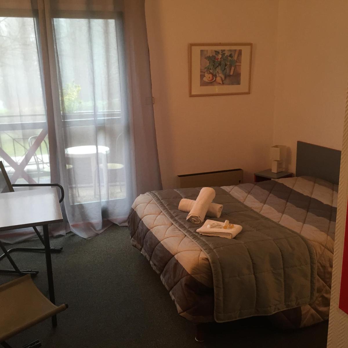 Un ou plusieurs lits dans un hébergement de l'établissement Le Pavillon