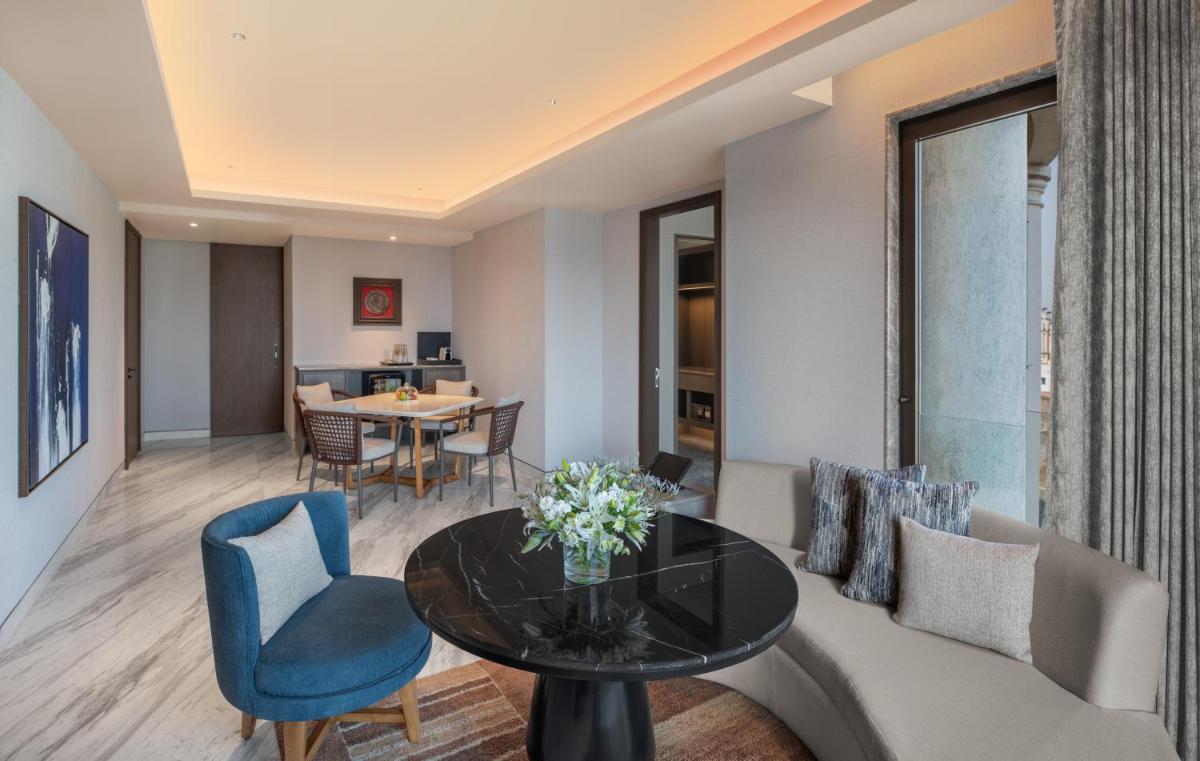 a living room with a couch and a table at The Residency Towers in Chennai