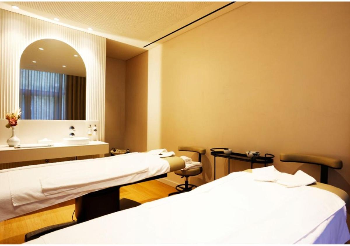 Uma cama ou camas num quarto em Montebelo Viseu Congress Hotel & Spa